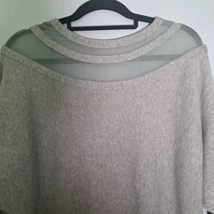 Moewy Grey, long sleeve knit top with cut outs at neckline. One size.